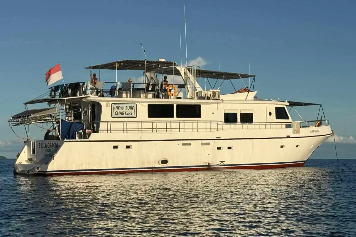 White charter yacht floating on clear blue water
