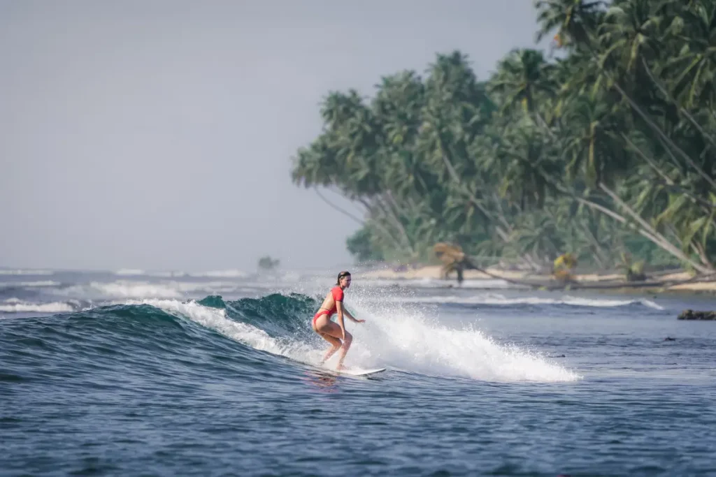 girl surfing on sea waves
