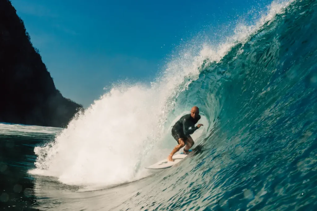 guy enjoying surfing on sea waves