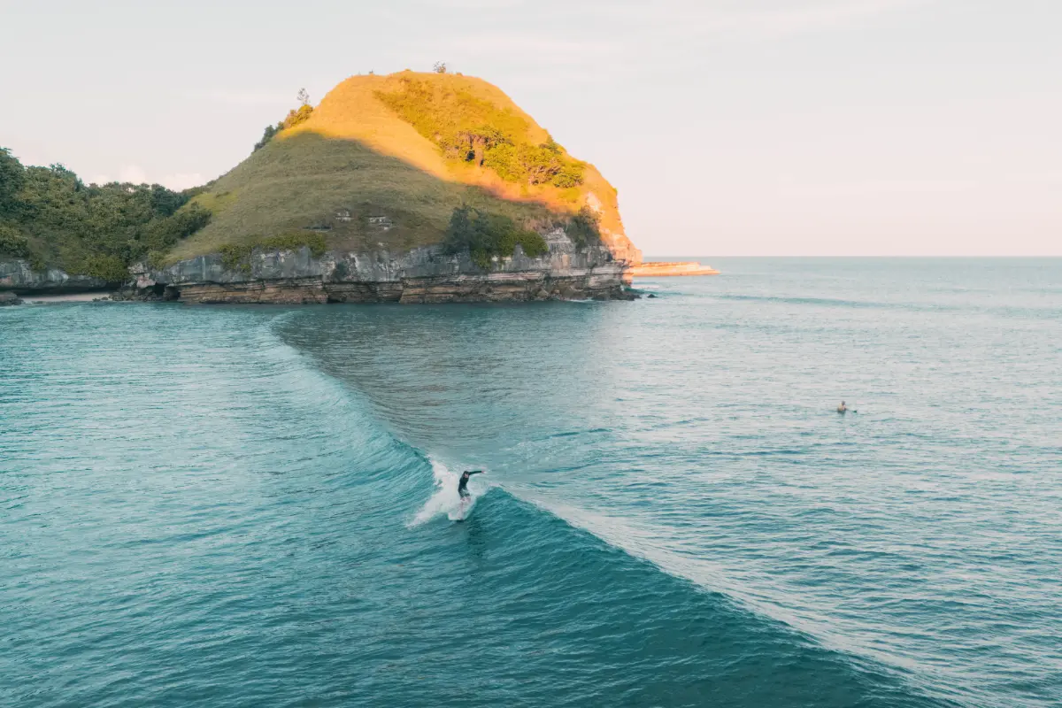 person enjoying surfing on little sea waves