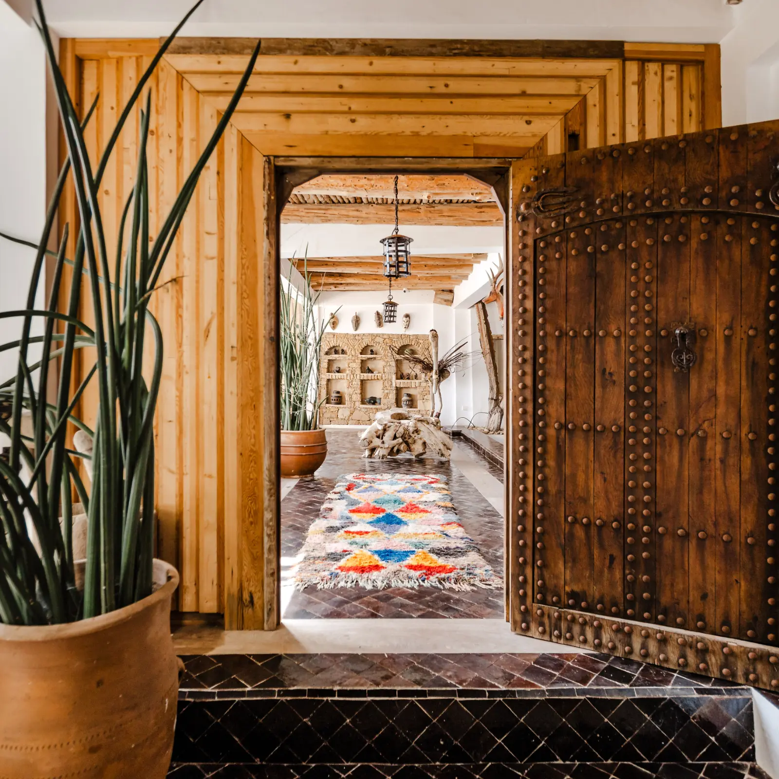 Open door showing a colorful rug on the floor